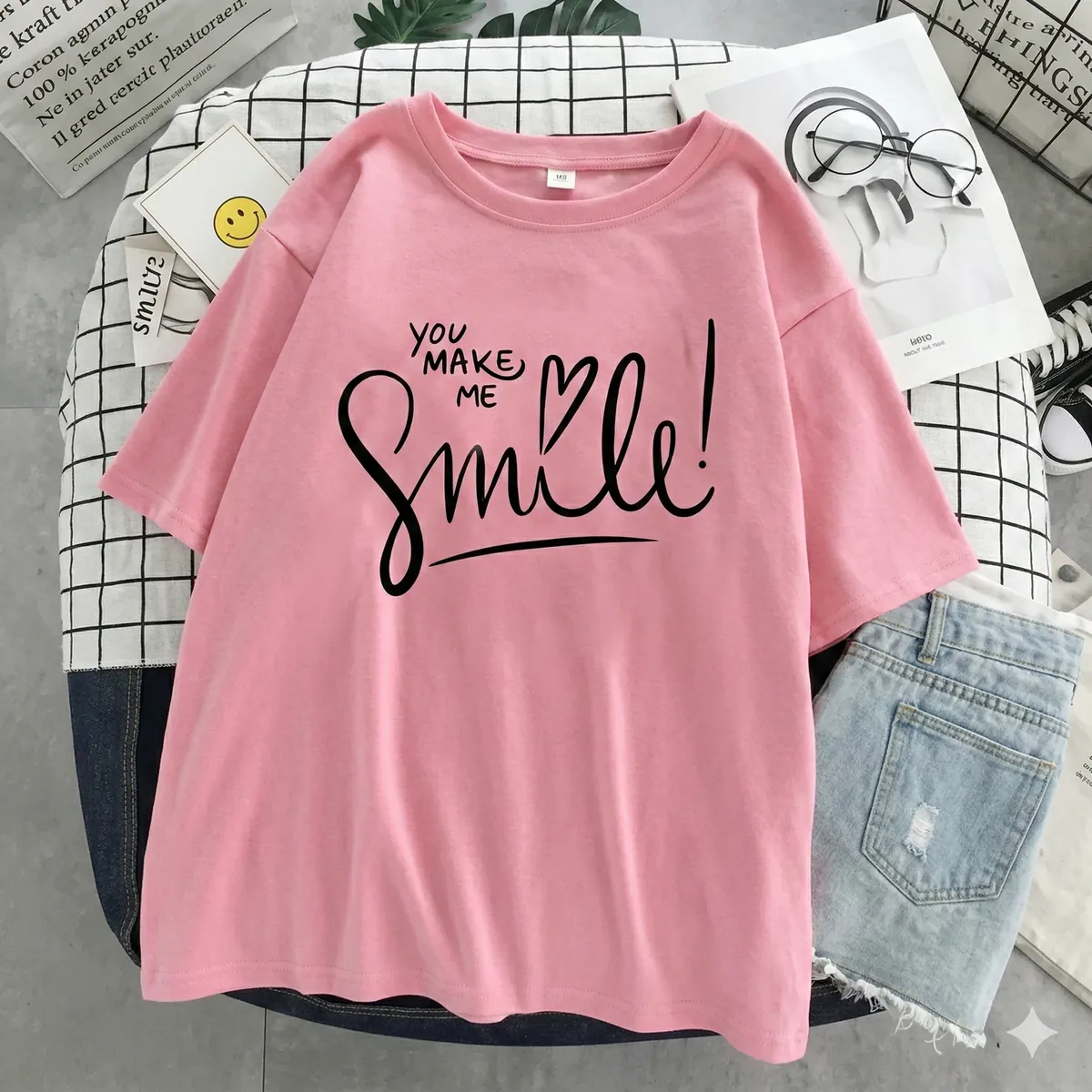 Pink graphic t-shirt flat lay before AI modeling