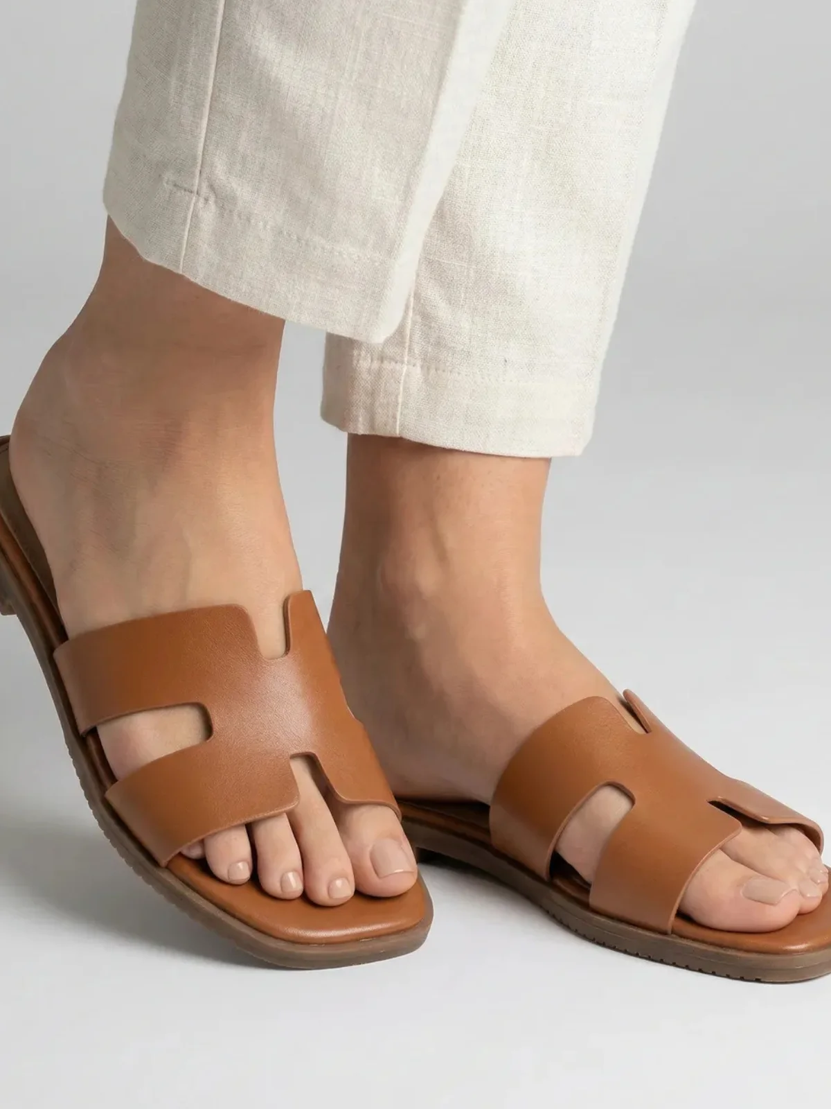 Model wearing sandals close-up after AI conversion